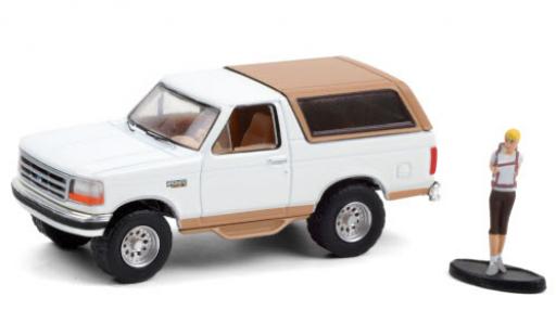Ford Bronco 1/64 Greenlight Eddie Bauer blanche/matt-beige 1996 avec figurine miniature